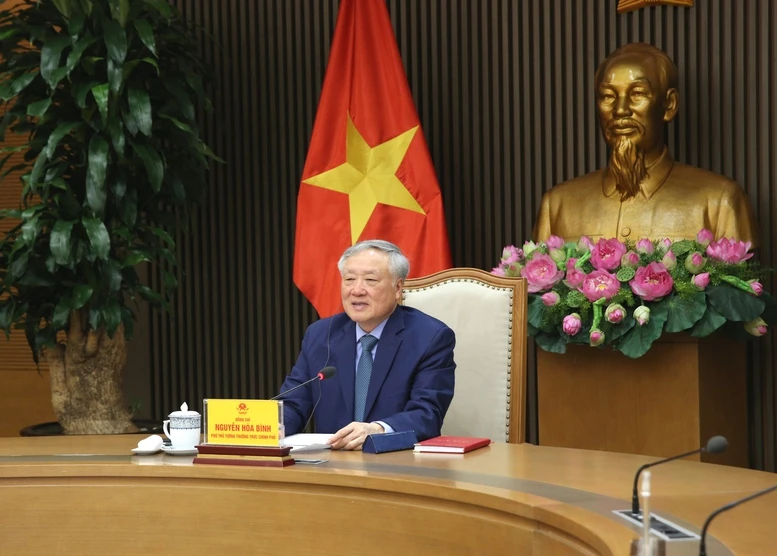 Phó Thủ tướng Thường trực Nguyễn Hòa Bình điện đàm với nguyên Phó Thủ tướng Singapore Vương Thụy Kiệt- Ảnh 1.